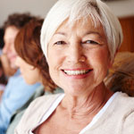 older-woman-on-couch-with-family-sq-150